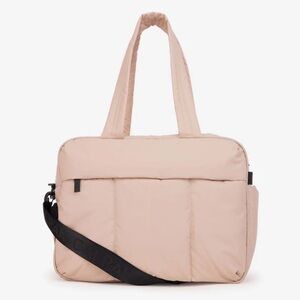 CALPAK Luka Duffel in Rose Quartz.
